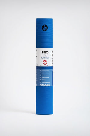 SEA YOGI // Prolite mat, 6mm thick and in Truth Blue style by Manduka, standing image